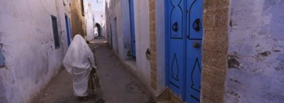 Rear view of a woman walking on the street Medina Kairwan Tunisia Canvas Art - Panoramic Images (18 x 7)