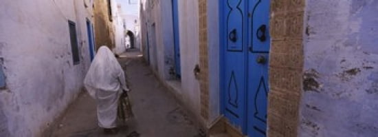 Rear view of a woman walking on the street Medina Kairwan Tunisia Canvas Art - Panoramic Images (36 x 13)