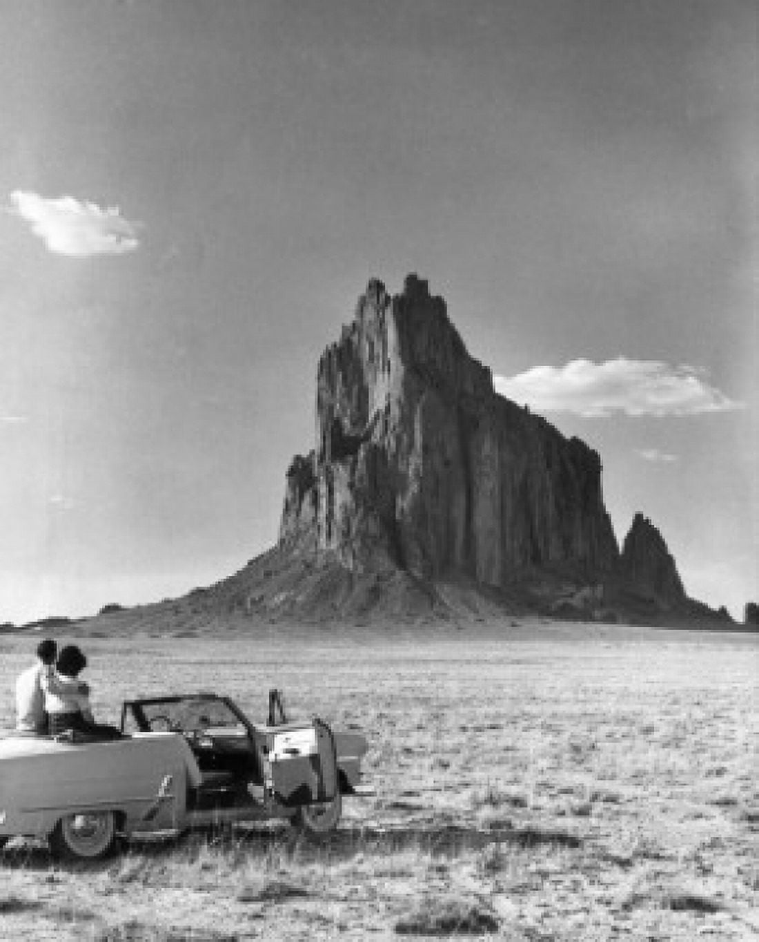 Rear view of a young couple sitting in a convertible car Canvas Art - (18 x 24)