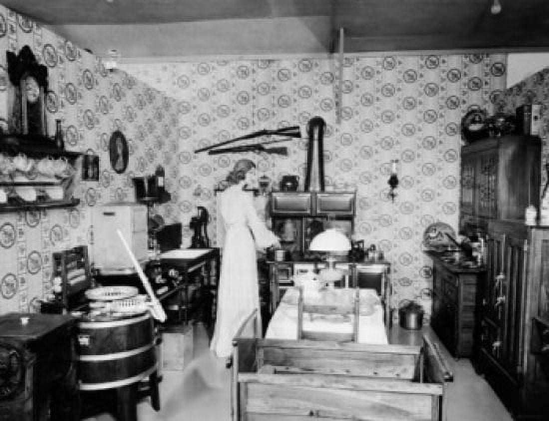 Rear view of a young woman preparing food in a kitchen Pioneer Village Minden Nebraska USA Canvas Art - (18 x 24)