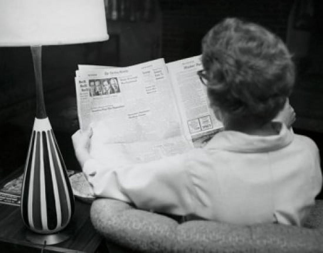 Rear view of a young woman reading a newspaper Canvas Art - (18 x 24)