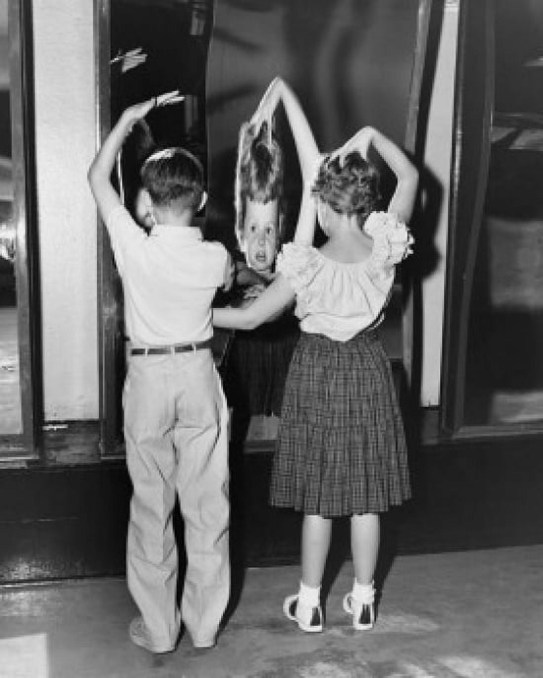 Rear view of boy and girl looking in fun mirror Canvas Art - (18 x 24)
