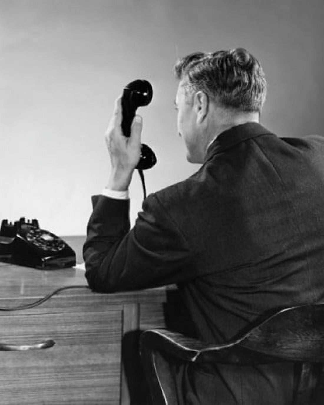 Rear view of businessman holding telephone receiver Canvas Art - (24 x 36)