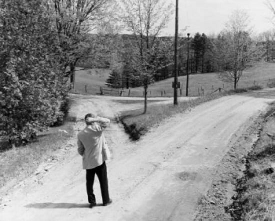 Rear view of businessman standing at fork in road scratching his head Canvas Art - (18 x 24)