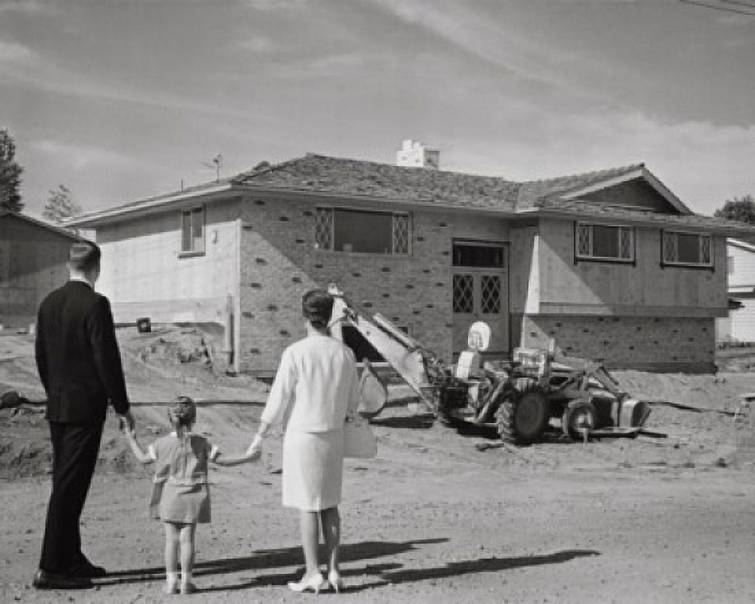 Rear view of couple and their daughter looking at nearly completed house Canvas Art - (18 x 24)
