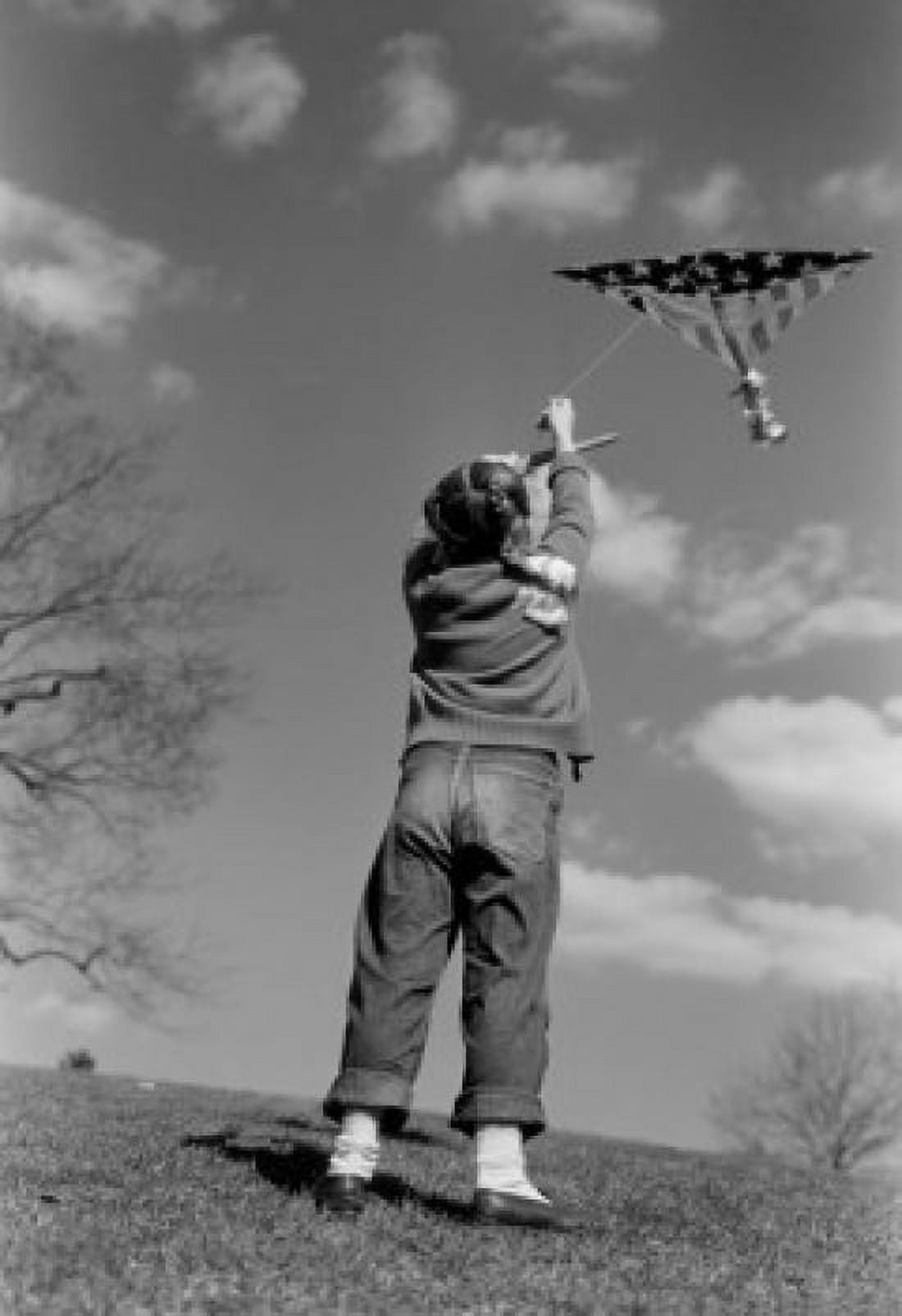 Rear view of little girl flying kite Canvas Art - (18 x 24)