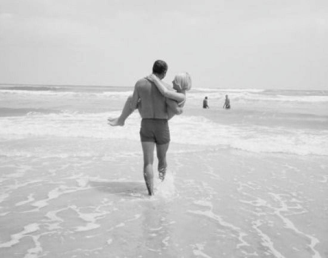 Rear view of man carrying woman toward open sea Canvas Art - (18 x 24)