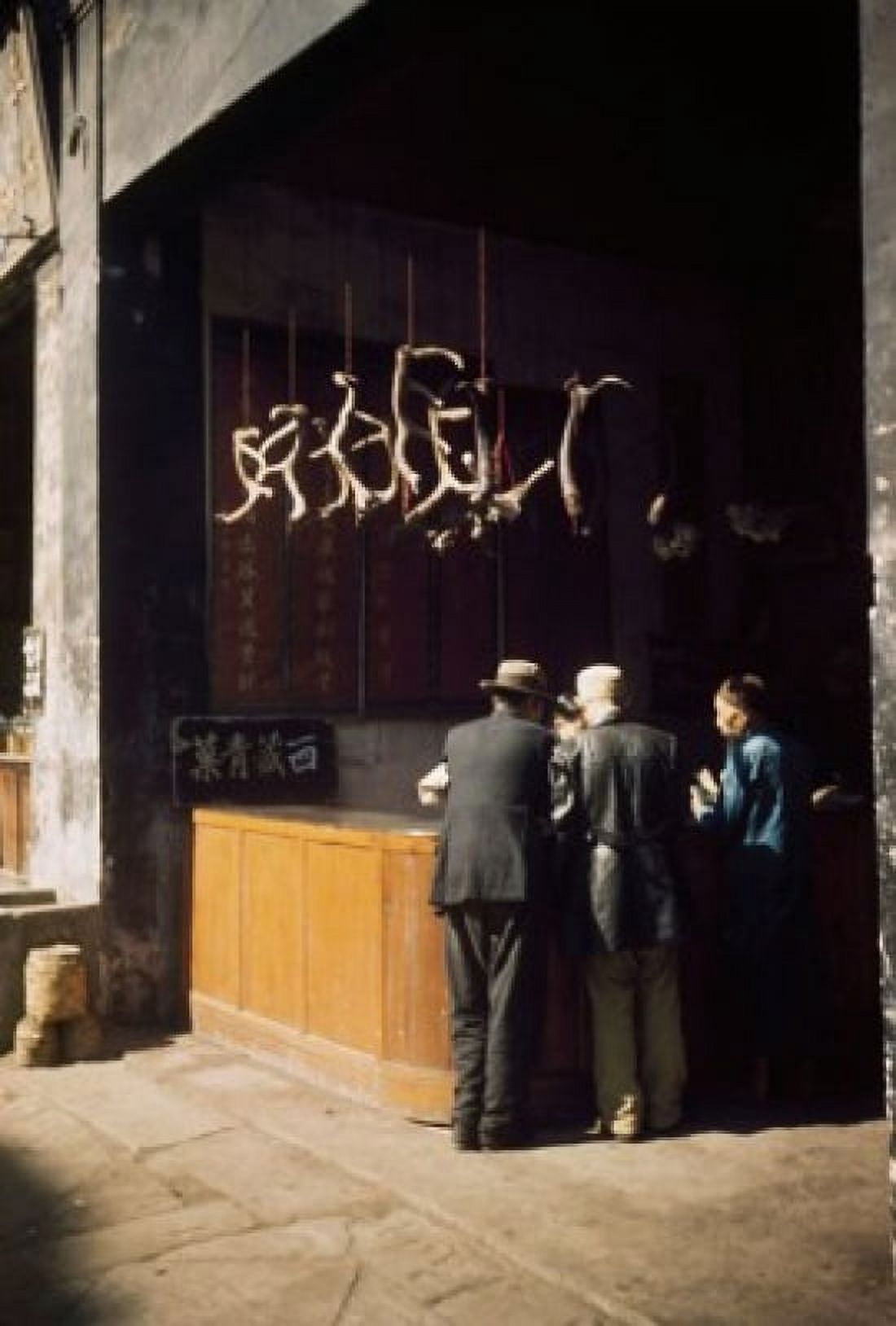 Rear view of three people standing at a herbal medicine store China Canvas Art - (18 x 24)
