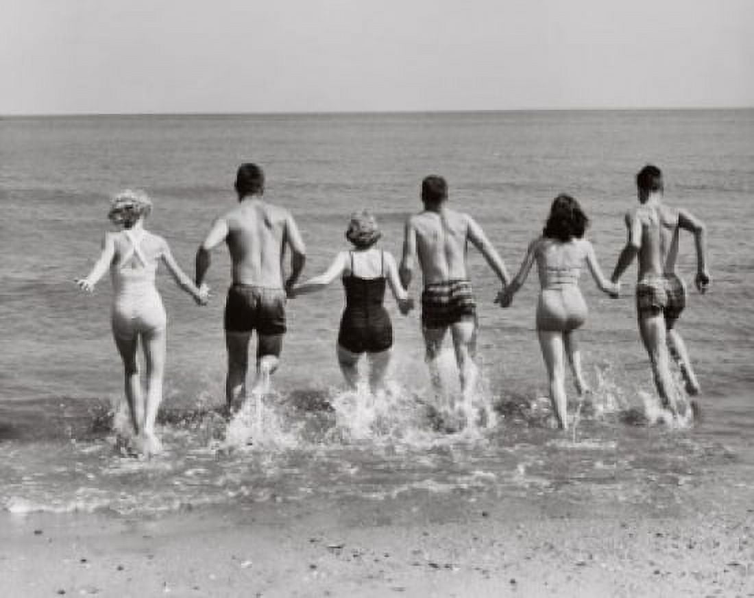 Rear view of three young couples running on the beach Canvas Art - (18 x 24)