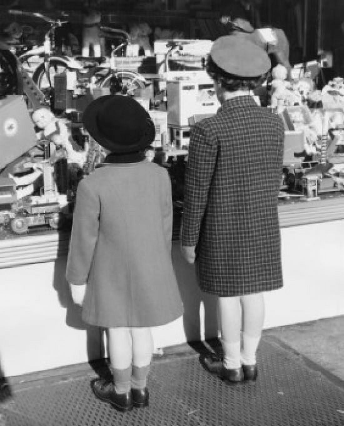 Rear view of two girls looking at toys in display window of toy store Canvas Art - (18 x 24)