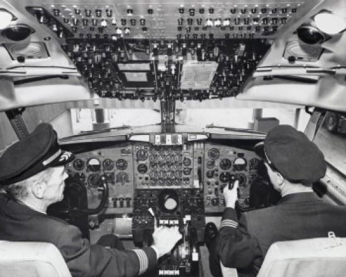 Rear view of two pilots sitting in the cockpit of an airplane Canvas Art - (18 x 24)