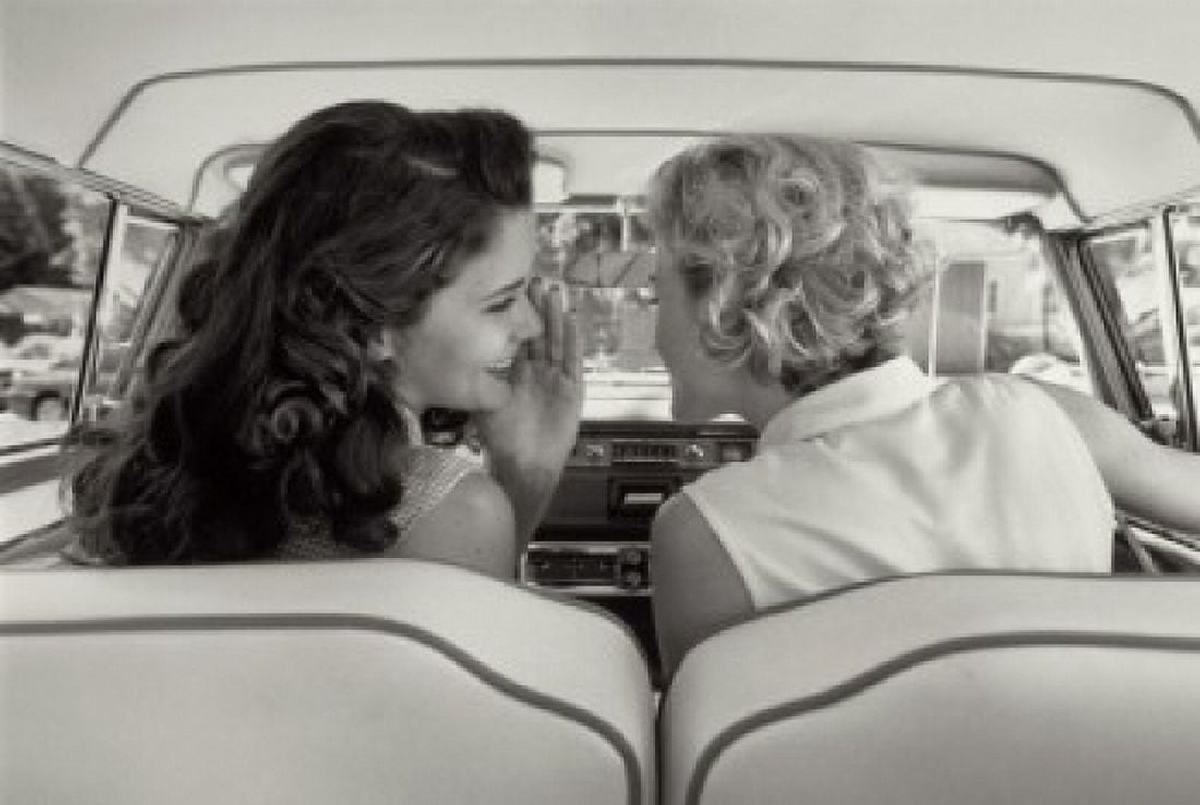Rear view of two young women talking in car Canvas Art - (18 x 24)