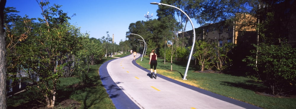 Rear view of woman jogging in a park The 606 Bloomingdale Trail Chicago Cook County Illinois USA Canvas Art - Panoramic Images (36 x 12)