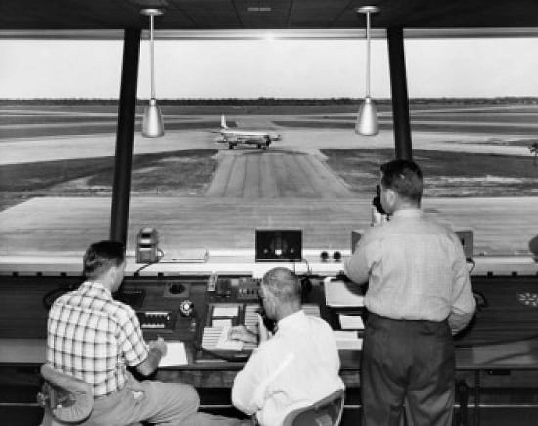 Rear view of three technicians working in an air traffic control tower Sarasota-Bradenton International Airport Sarasota Florida USA Canvas Art - (24 x 36)