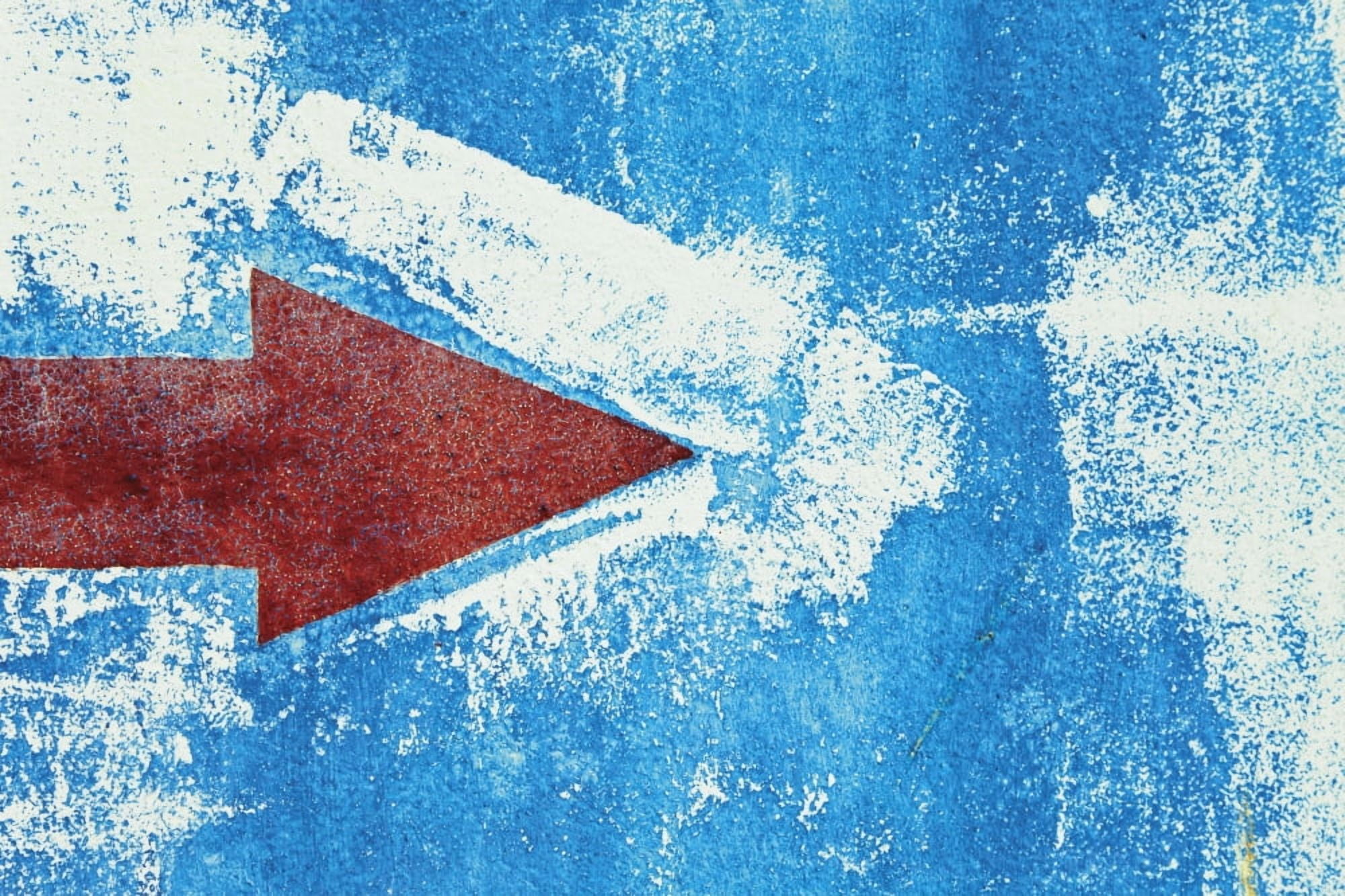 Red Arrow Painted On Blue Wall Canvas Art - Ken Welsh Design Pics (34 x 22)
