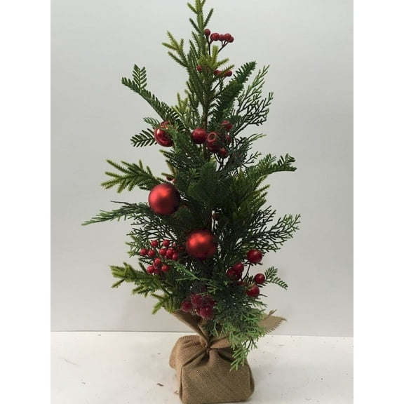 Red Berries And Ball Ornaments On Green Boughs Potted Christmas Tree