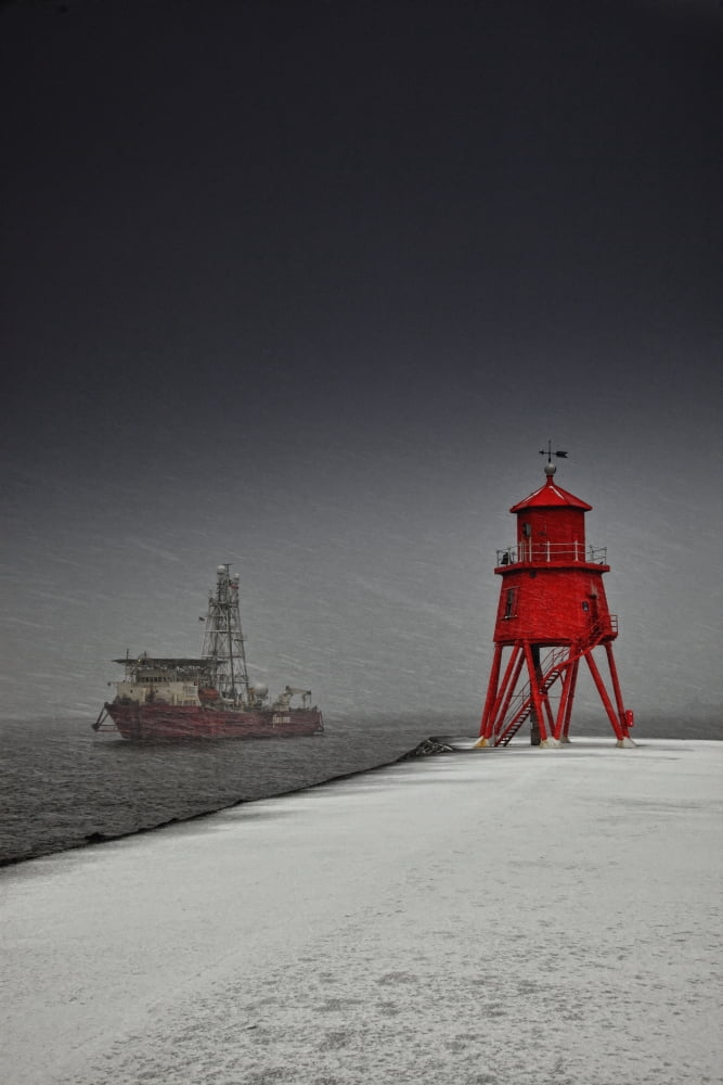 A Red Lighthouse Along The Coast In Winter With A Boat Off The Shore In The Water South Shields Tyne And Wear England Canvas Art - John Short Design Pics (12 x 19)