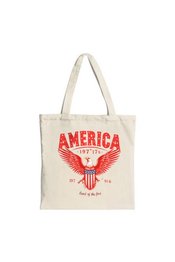 Red eagle with outstretched wings in bold red and " Land of the free " in cursive Perfect canvas tote for shopping and travel