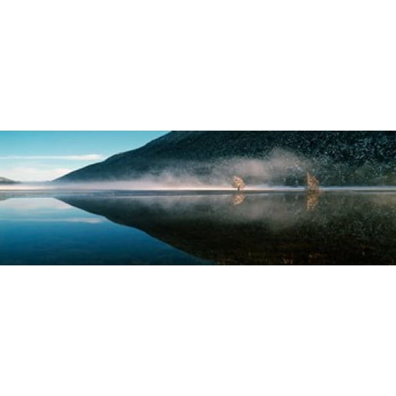 Reflection of a mountain with snowy trees on a lake in winter afternoon, Cote d'Azur, France Poster Print (18 x 7)