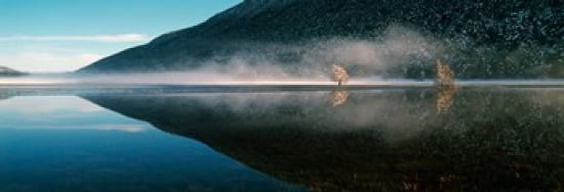 Reflection of a mountain with snowy trees on a lake in winter afternoon Cote dAzur France Canvas Art - Panoramic Images (36 x 13)