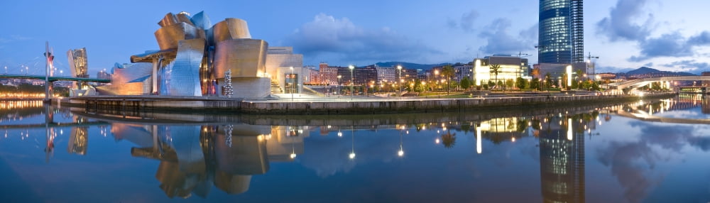 Reflection of a museum on water Guggenheim Museum Bilbao Basque Country Spain Canvas Art - Panoramic Images (27 x 9)