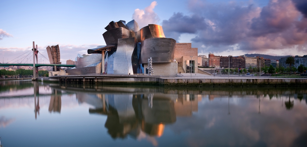 Reflection of a museum on water Guggenheim Museum Bilbao Basque Country Spain Canvas Art - Panoramic Images (36 x 12)