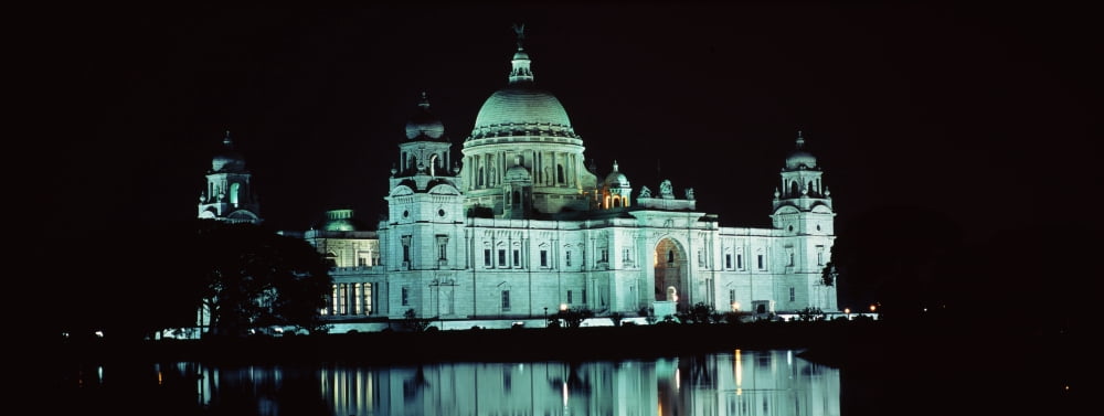 Reflection of a palace in water at night Victoria Memorial Kolkata West Bengal India Canvas Art - Panoramic Images (36 x 12)