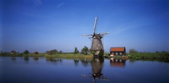 Reflection of a traditional windmill in a lake Netherlands Canvas Art - Panoramic Images (24 x 12)