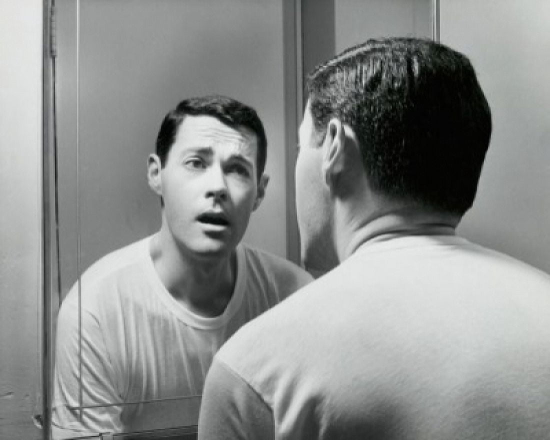 Reflection of a young man in a mirror Canvas Art - (24 x 36)
