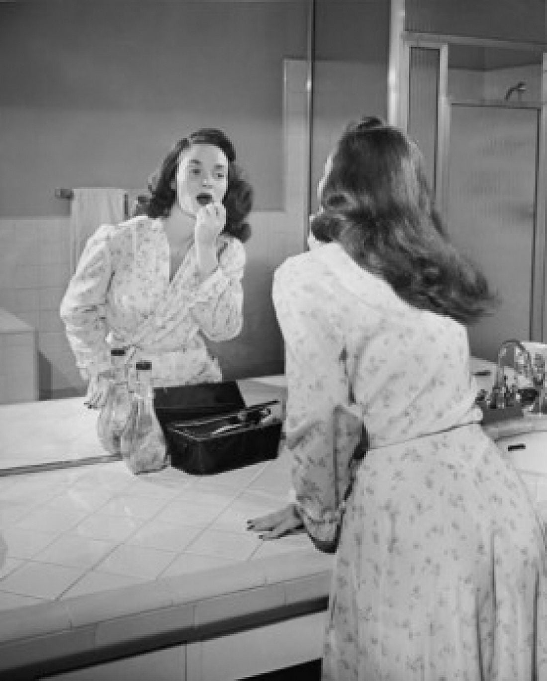 Reflection of a young woman applying a lipstick in a mirror Canvas Art - (18 x 24)