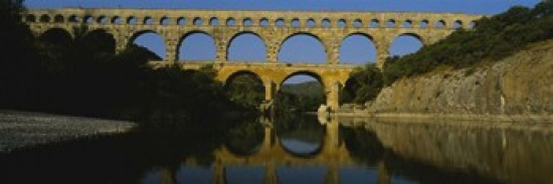 Reflection of an arch bridge in a river Pont Du Gard France Canvas Art - Panoramic Images (18 x 6)