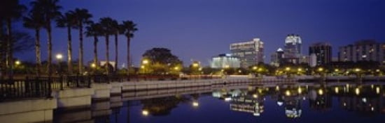 Reflection of buildings in water Orlando Florida USA Canvas Art - Panoramic Images (36 x 12)