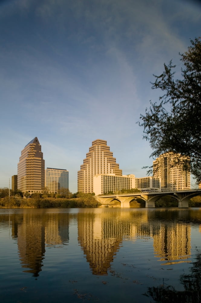 Reflection of buildings in water Town Lake Austin Texas USA Canvas Art - Panoramic Images (27 x 9)