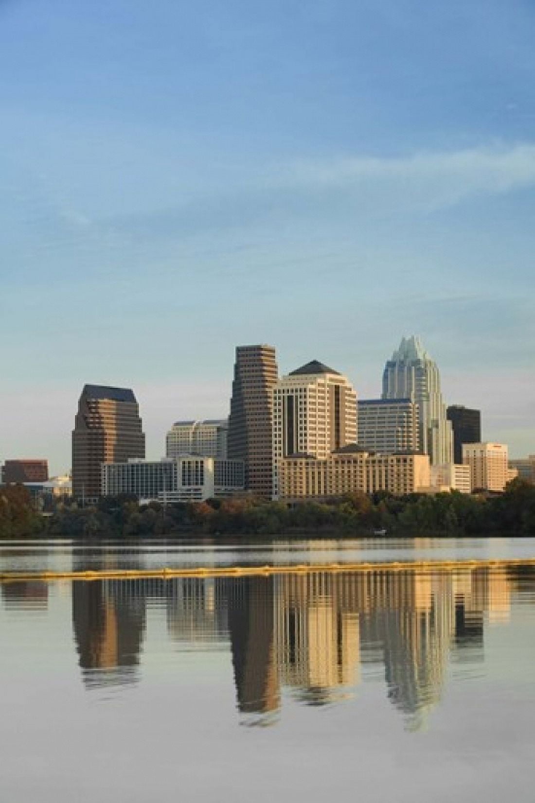 Reflection of buildings in water Town Lake Austin Texas USA Canvas Art - Panoramic Images (36 x 24)