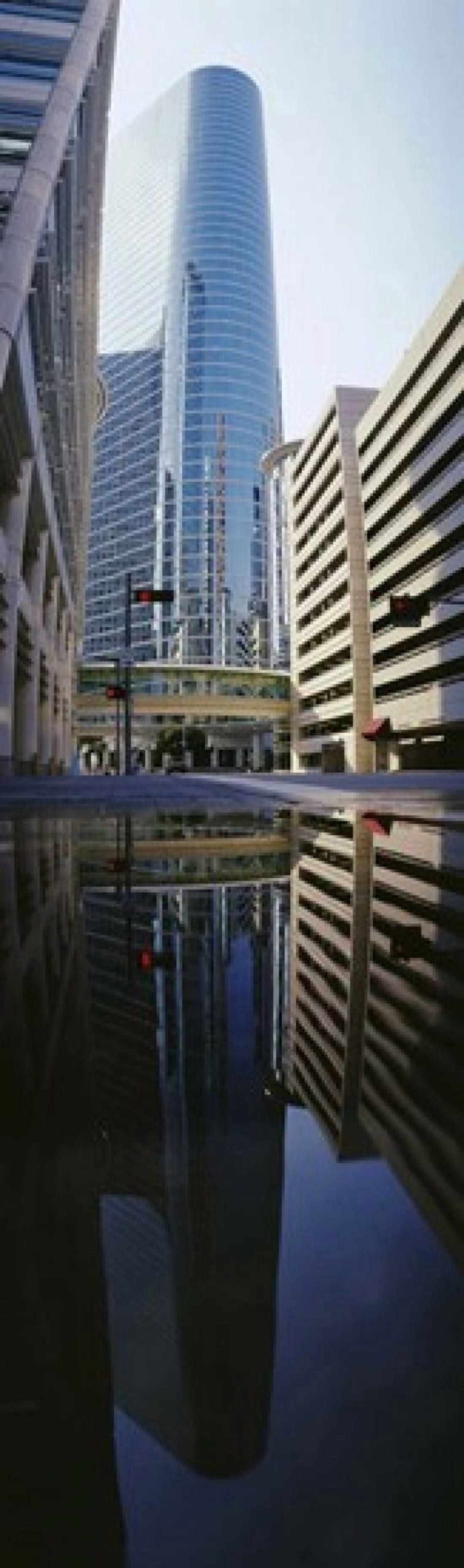 Reflection of buildings on water Houston Texas USA Canvas Art - Panoramic Images (15 x 5)