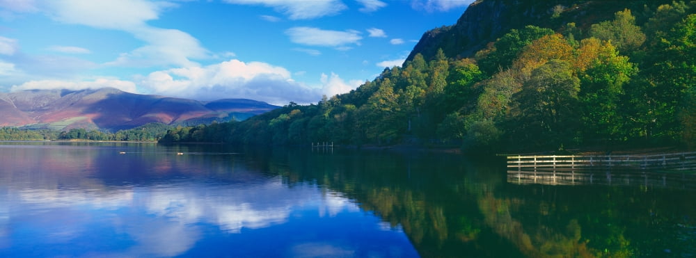 Reflection of clouds in a lake Derwentwater Lake District Lake District National Park England Canvas Art - Panoramic Images (36 x 12)