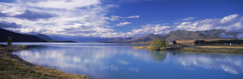 Reflection of clouds in a lake Fiordland National Park South Island New Zealand Canvas Art - Panoramic Images (12 x 36)