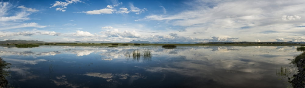 Reflection of clouds in a lake Lake Cuitzeo Michoacan State Mexico Canvas Art - Panoramic Images (36 x 12)