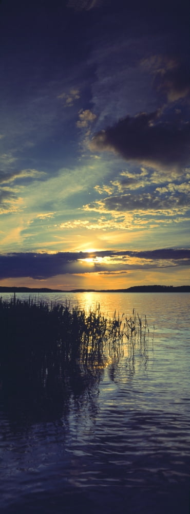 Reflection of clouds in a lake Lake Saimaa Joutseno Finland Canvas Art - Panoramic Images (36 x 12)