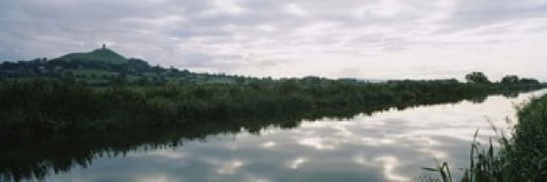 Reflection of clouds in the river River Brue Glastonbury Tor Glastonbury Somerset England Canvas Art - Panoramic Images (18 x 6)