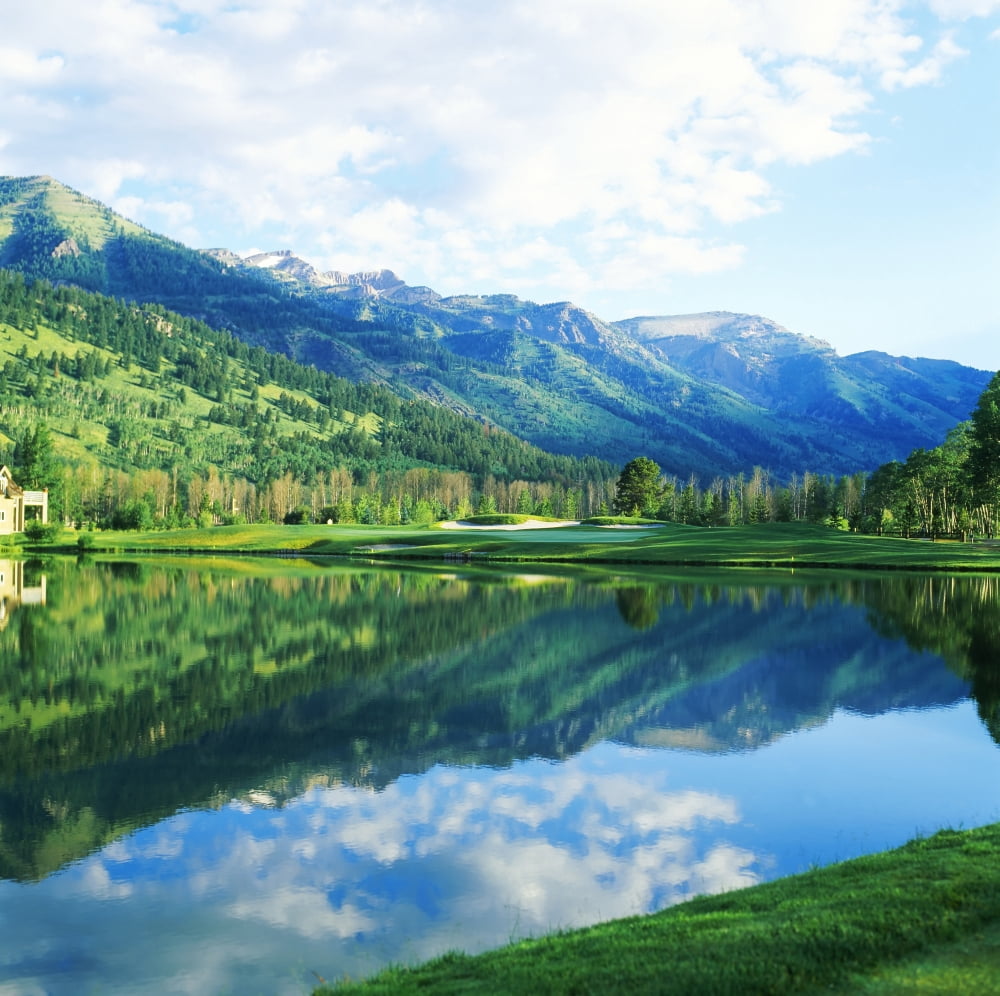 Reflection of clouds on water Teton Pines Golf Course Jackson Wyoming USA Canvas Art - Panoramic Images (24 x 24)