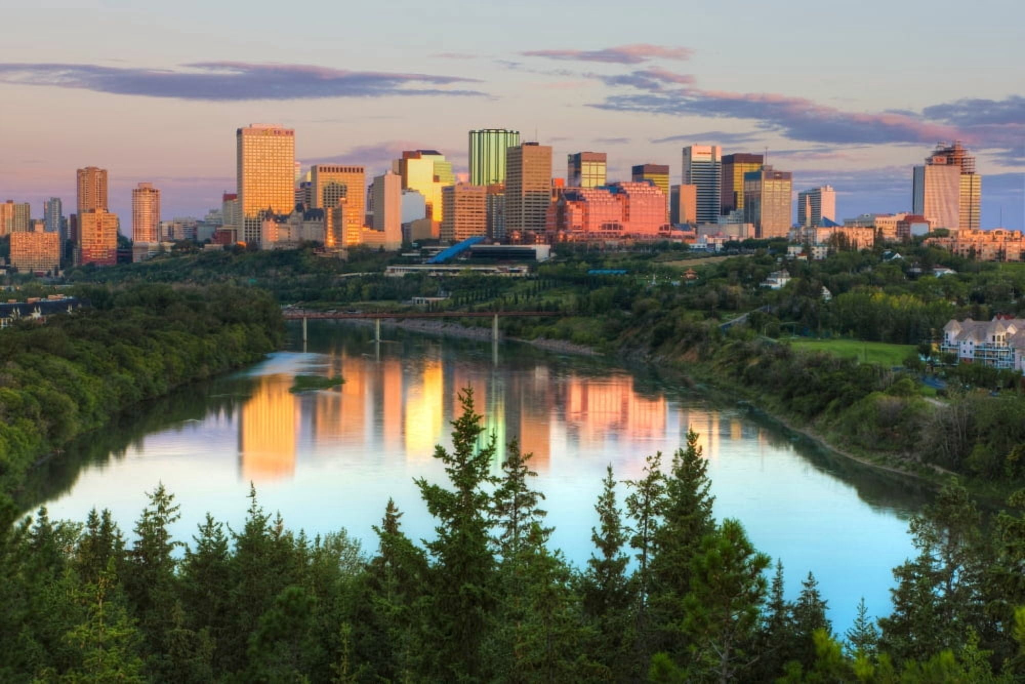 Reflection of downtown buildings in water at sunrise North Saskatchewan River Edmonton Alberta Canada Canvas Art - Panoramic Images (27 x 9)