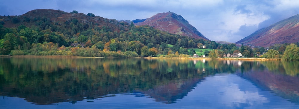 Reflection of hills in a lake Grasmere Lake District Lake District National Park England Canvas Art - Panoramic Images (27 x 9)