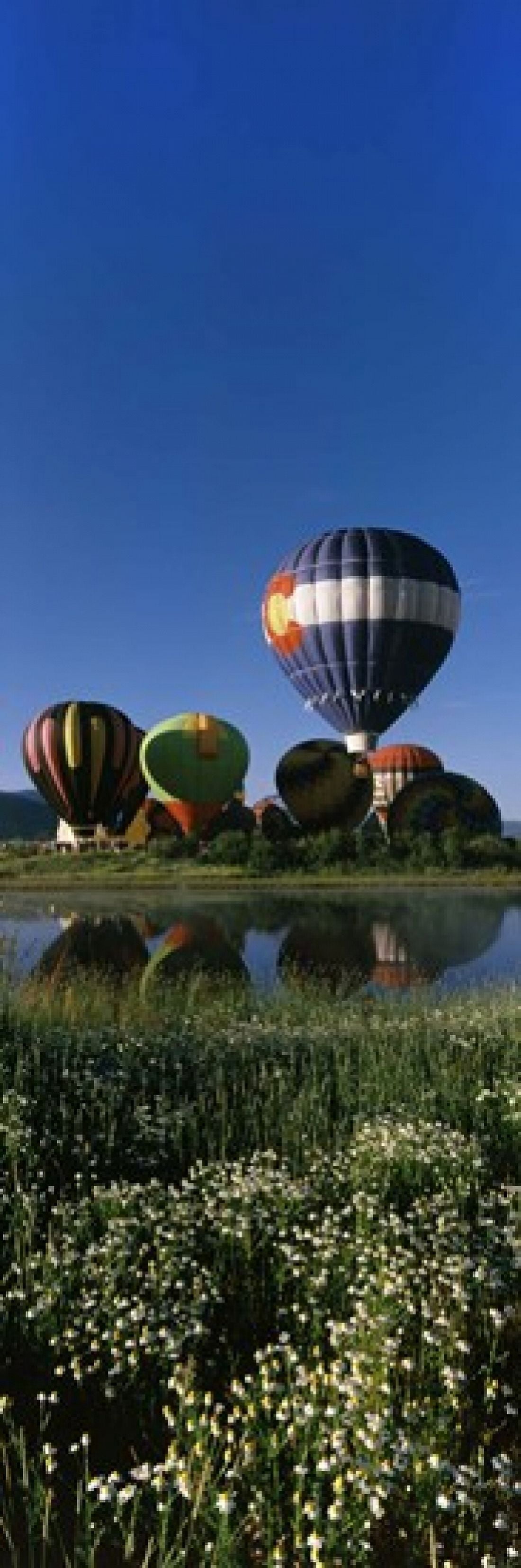 Reflection of hot air balloons in a lake Hot Air Balloon Rodeo Steamboat Springs Routt County Colorado USA Canvas Art - Panoramic Images (18 x 6)