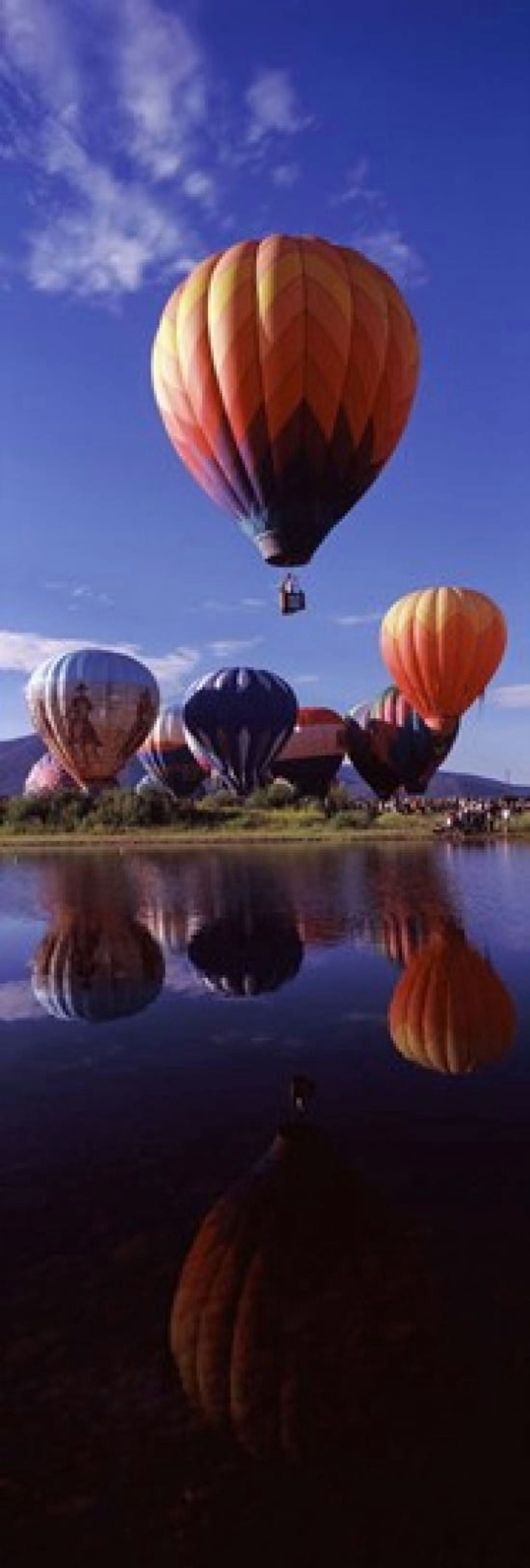 Reflection of hot air balloons in a lake Hot Air Balloon Rodeo Steamboat Springs Routt County Colorado USA Canvas Art - Panoramic Images (36 x 12)