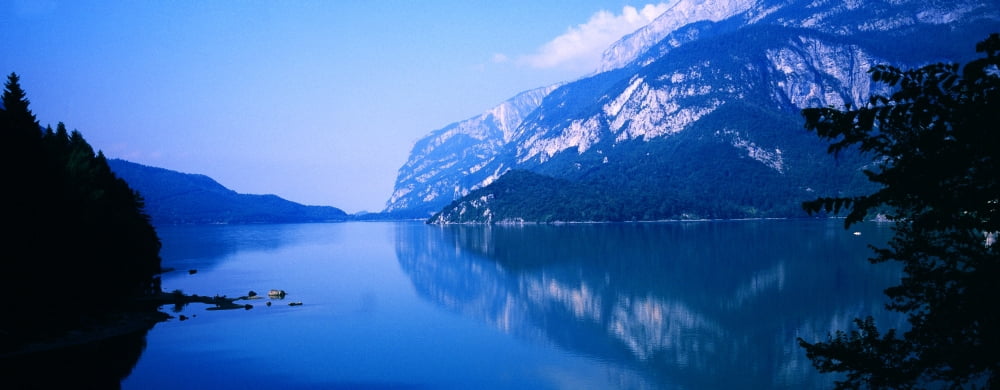 Reflection of mountain in a lake Lake Molveno Trentino Italy Canvas Art - Panoramic Images (36 x 12)