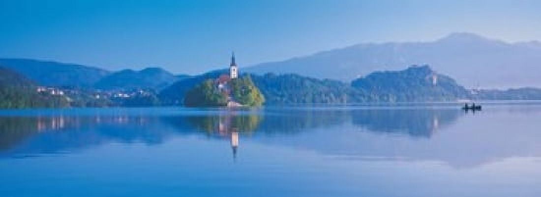 Reflection of mountains and buildings in water Lake Bled Slovenia Canvas Art - Panoramic Images (18 x 7)