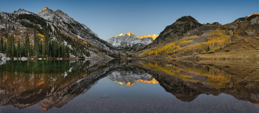 Reflection of mountains in a lake Maroon Bells Aspen Pitkin County Colorado USA Canvas Art - Panoramic Images (36 x 12)