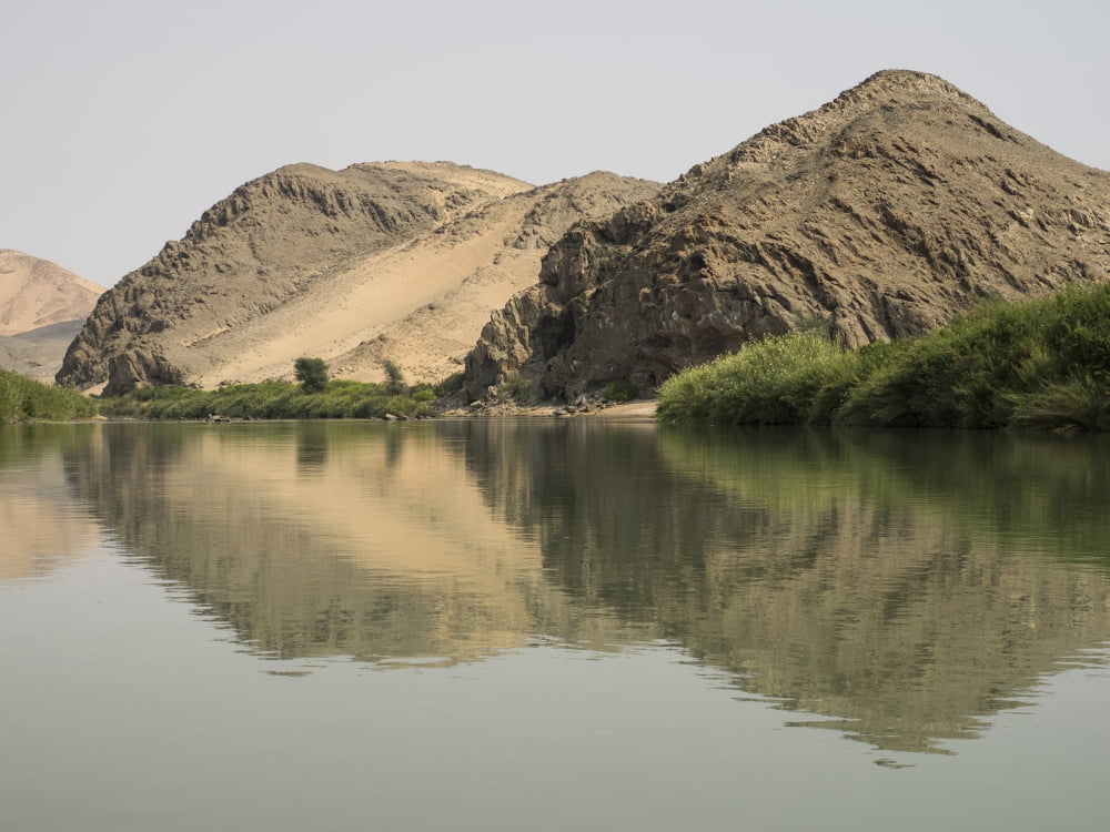 Reflection of rock on water Kunene River Angola Namibia Canvas Art - Panoramic Images (12 x 16)
