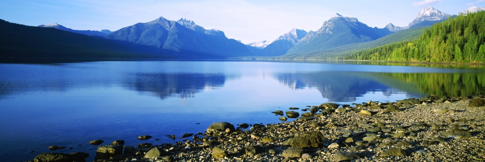 Reflection of rocks in a lake McDonald Lake Glacier National Park Montana USA Canvas Art - Panoramic Images (36 x 12)